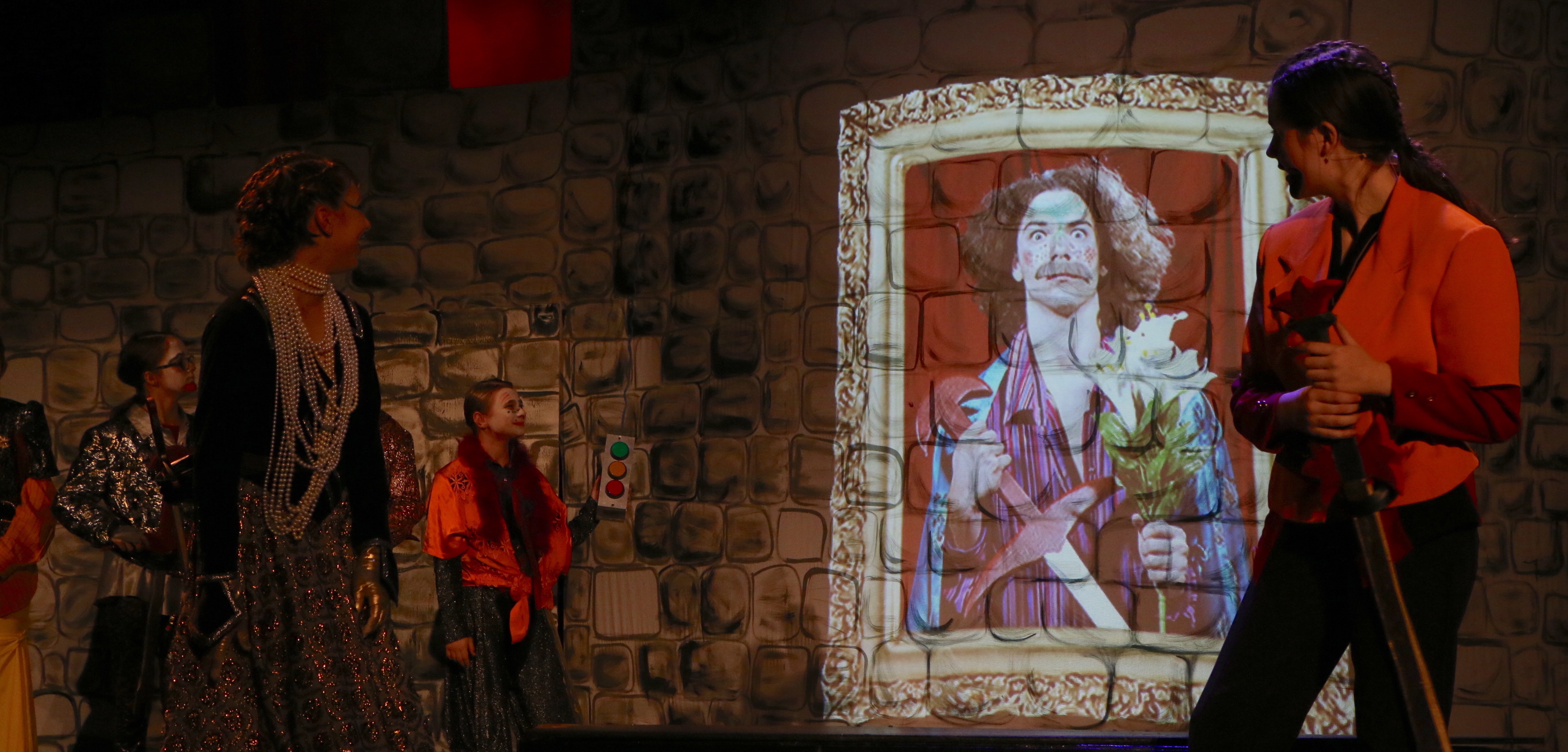 Actors performing with projection in background